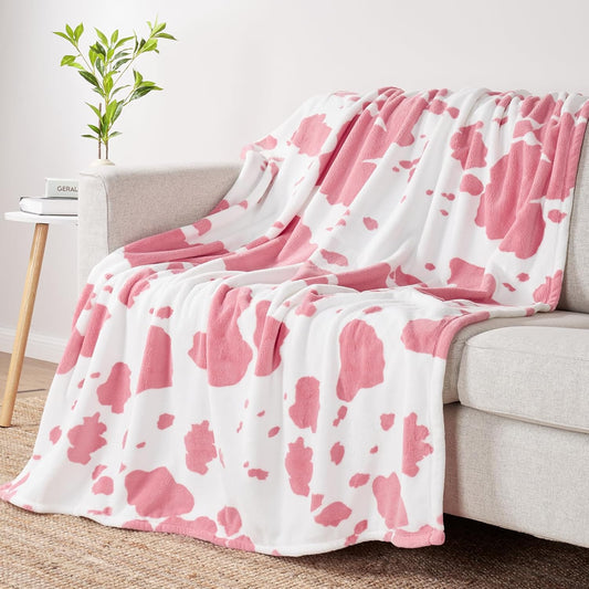 Click to see full view      4+  7 VIDEOS Cozy Bliss Cow Print Fuzzy Throw Blanket